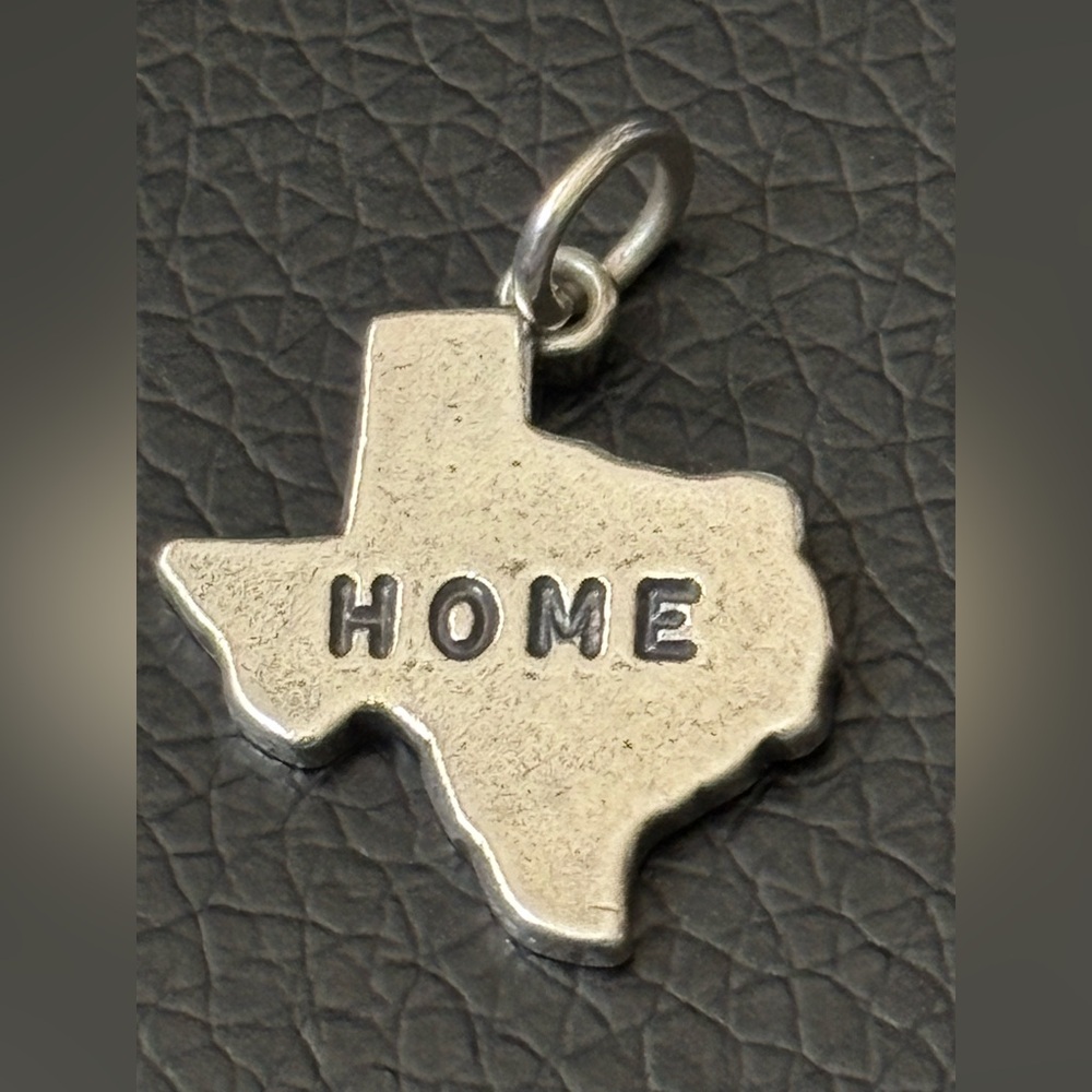 Retired James Avery Sterling Silver "Texas is Home" Charm.